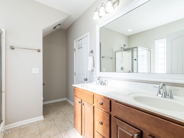 bathroom featuring vanity, tile patterned floors, and a shower with shower door