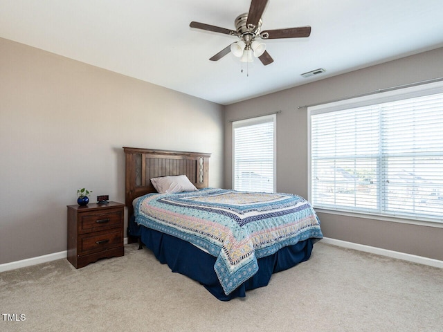 bedroom featuring ceiling fan and light colored carpet