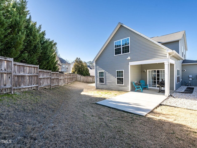 back of property with a patio