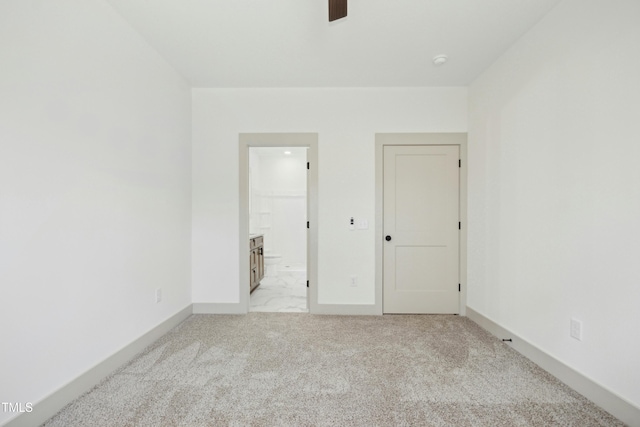 spare room with light carpet