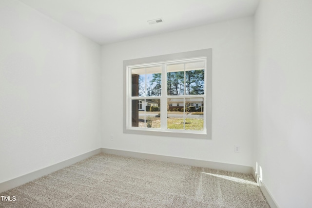 unfurnished room featuring carpet