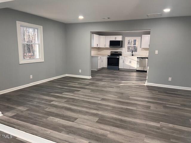 108 Seabreeze Rd, Hertford, NC 27944 - unfurnished living room with recessed lighting and dark wood-style floors