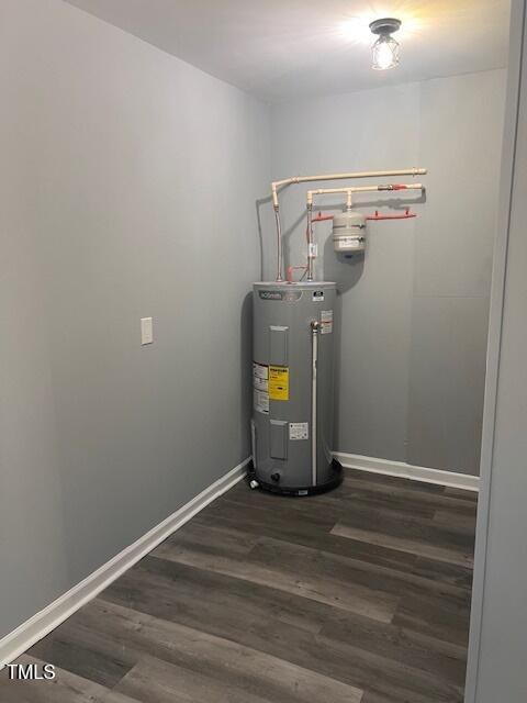 utility room featuring water heater