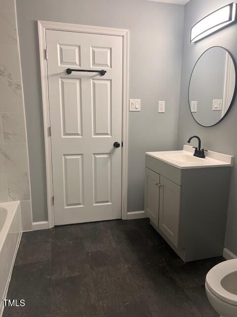 bathroom with vanity and toilet