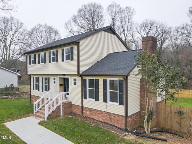 view of front facade with a front yard