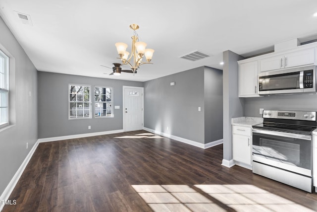 kitchen with white cabinetry, stainless steel appliances, and decorative light fixtures