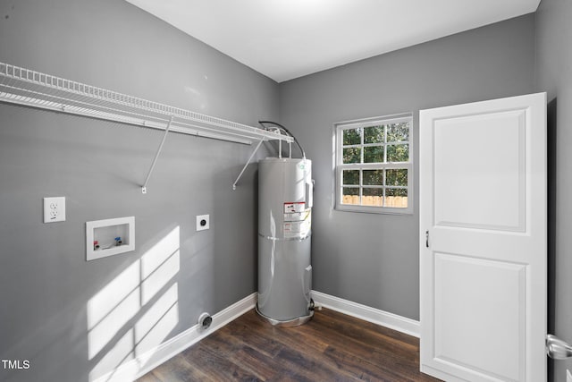 laundry area with hookup for an electric dryer, hookup for a washing machine, dark hardwood / wood-style flooring, and water heater