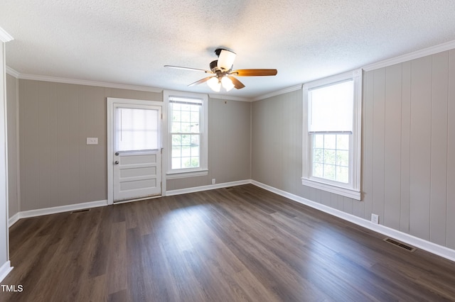 unfurnished room featuring a textured ceiling, dark hardwood / wood-style floors, ceiling fan, and crown molding