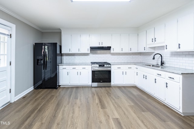 kitchen with white cabinetry, sink, black refrigerator with ice dispenser, and stainless steel gas range