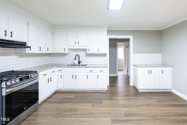 kitchen featuring white cabinets, sink, and stainless steel range with gas stovetop