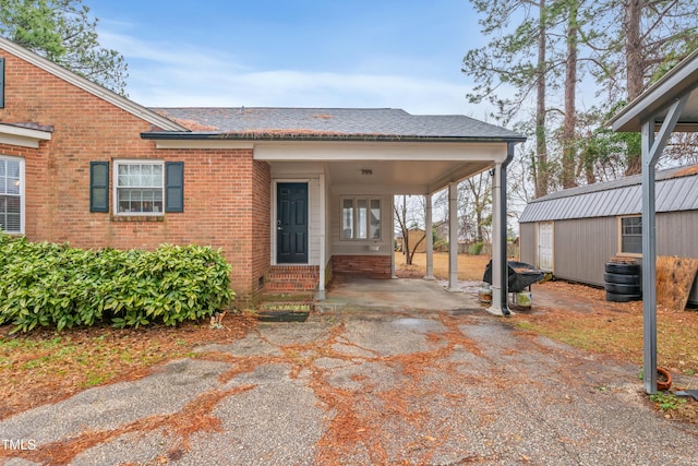 view of front of home with a carport