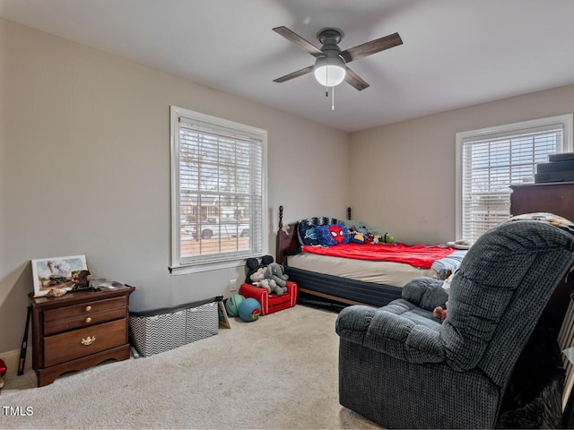 carpeted bedroom featuring ceiling fan