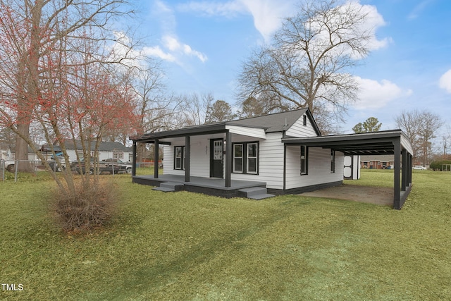 view of home's exterior featuring a carport, a porch, and a yard