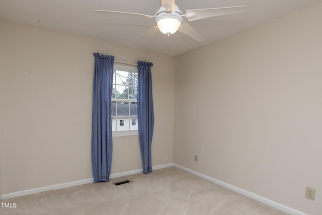 carpeted empty room with ceiling fan