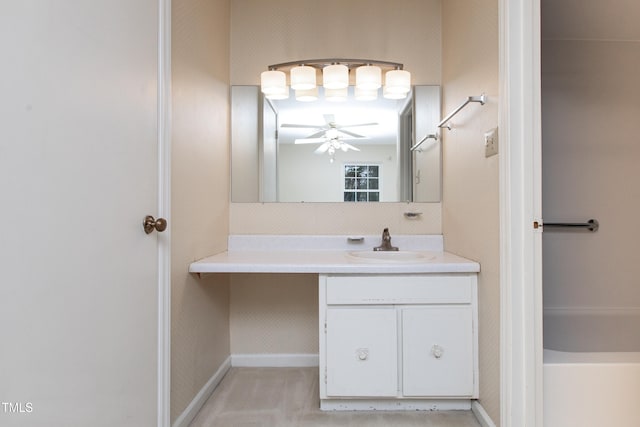 bathroom featuring a bathtub, vanity, and ceiling fan