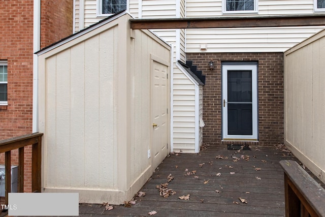 property entrance with a deck