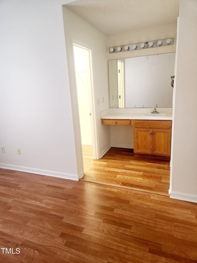 bathroom featuring vanity and hardwood / wood-style flooring