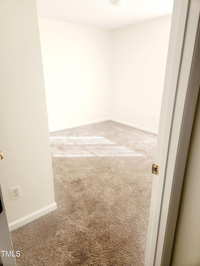 spare room featuring carpet flooring