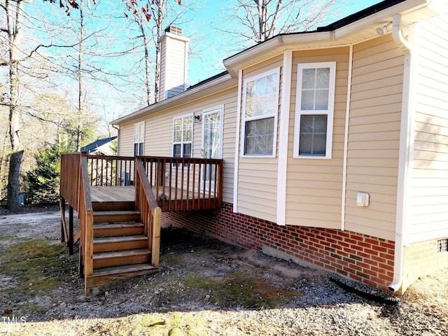 view of side of home featuring a deck