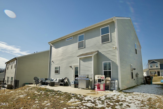 back of property with an outdoor living space