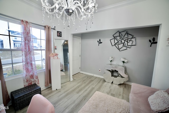 interior space featuring crown molding, light wood-type flooring, and a notable chandelier