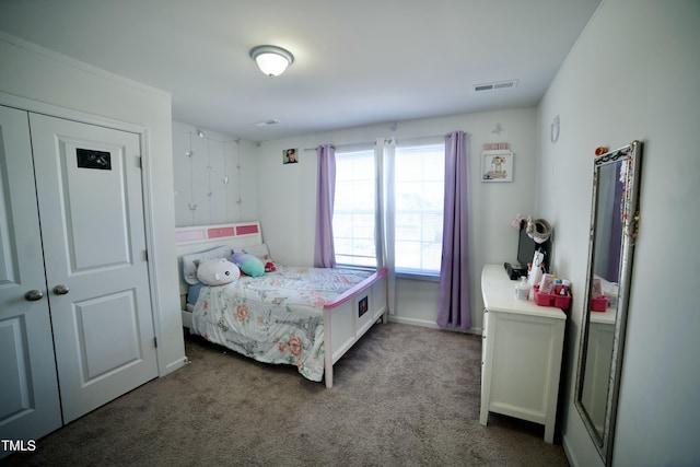 carpeted bedroom with a closet