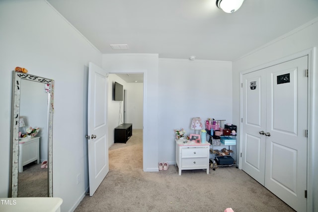 bedroom featuring light colored carpet