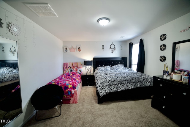 bedroom featuring light colored carpet