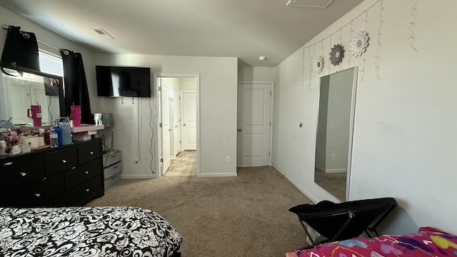 bedroom featuring light colored carpet