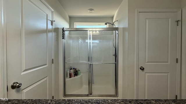 bathroom featuring an enclosed shower