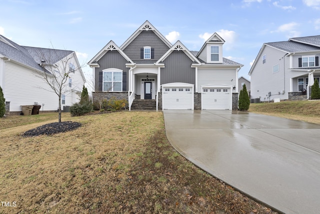 craftsman-style house featuring a front yard and a garage