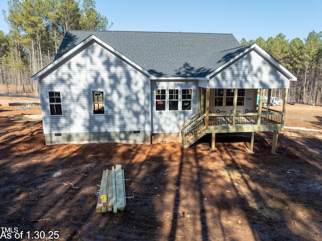 rear view of house featuring covered porch