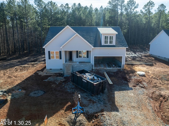 view of front of home with a garage and covered porch