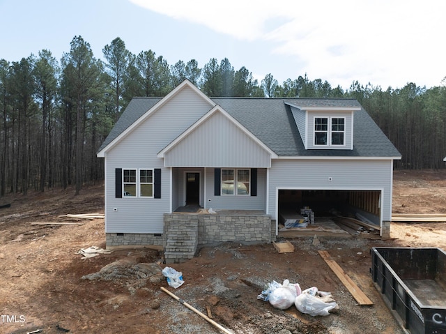 view of front of home with a garage, crawl space, roof with shingles, and covered porch