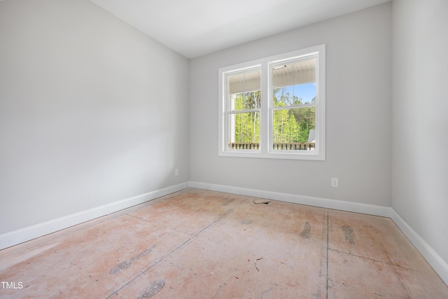 empty room with baseboards