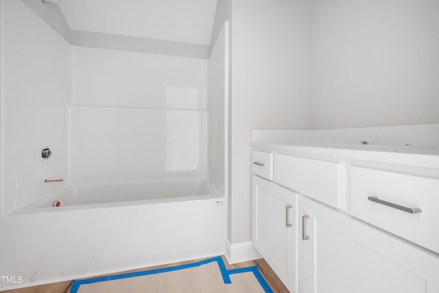 full bathroom with baseboards