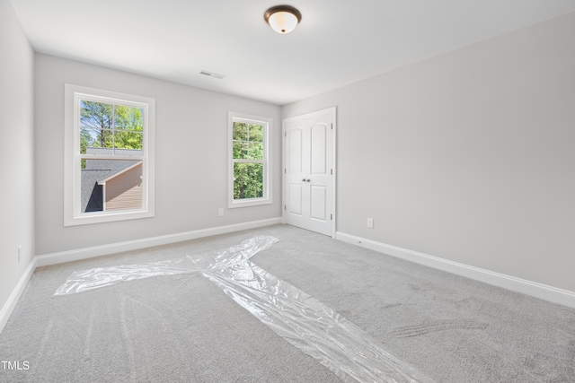 95 Purslane Dr, Franklinton, NC 27525 - carpeted empty room featuring healthy amount of natural light and baseboards