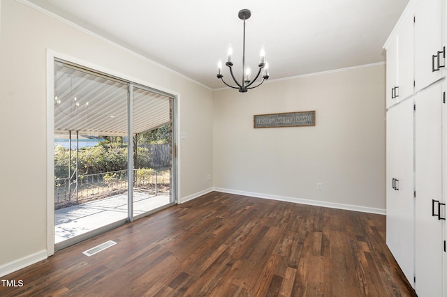 unfurnished dining area featuring a chandelier, dark hardwood / wood-style flooring, and crown molding