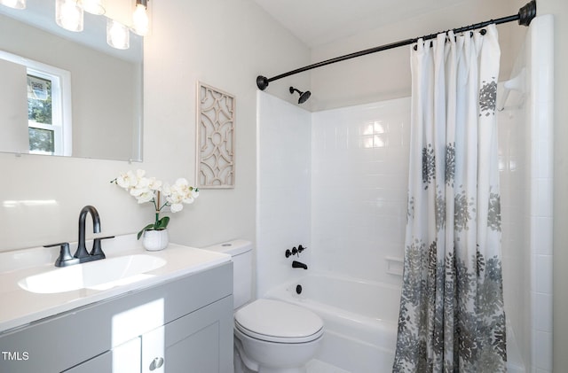 full bathroom featuring shower / bath combo, toilet, and vanity