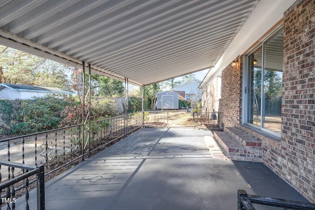 view of patio / terrace featuring a storage shed