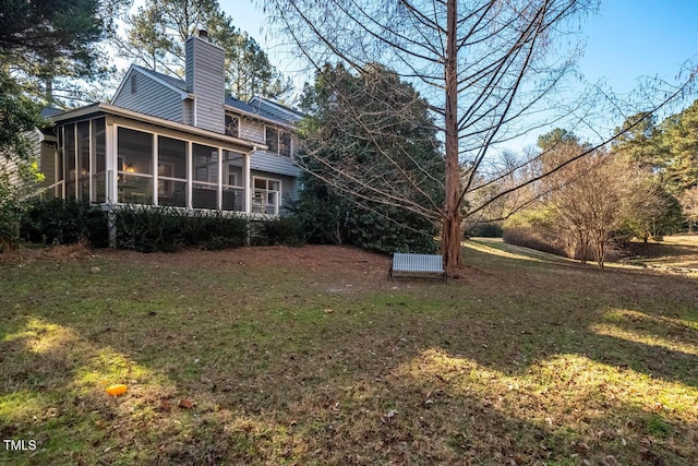 view of yard featuring a sunroom