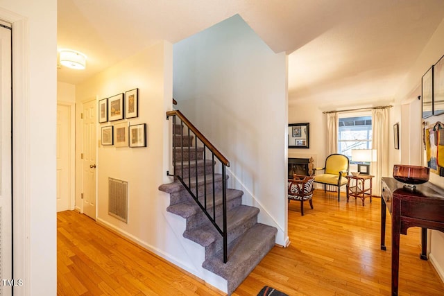 stairway featuring hardwood / wood-style flooring