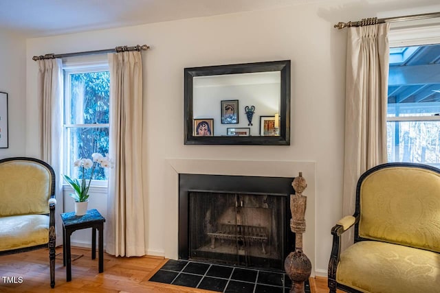 living area with hardwood / wood-style flooring