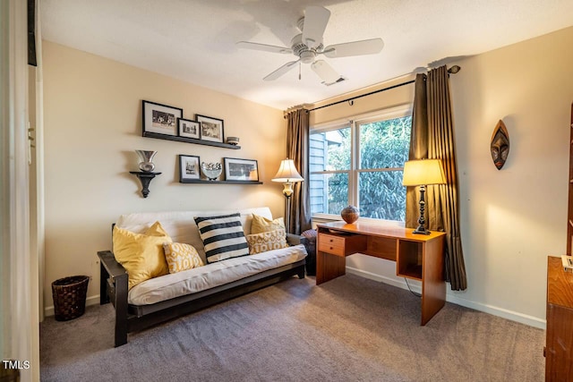 sitting room featuring ceiling fan and carpet floors