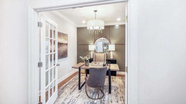 home office featuring wood-type flooring, ornamental molding, french doors, and an inviting chandelier