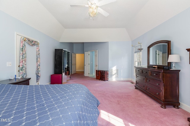 carpeted bedroom featuring vaulted ceiling and ceiling fan