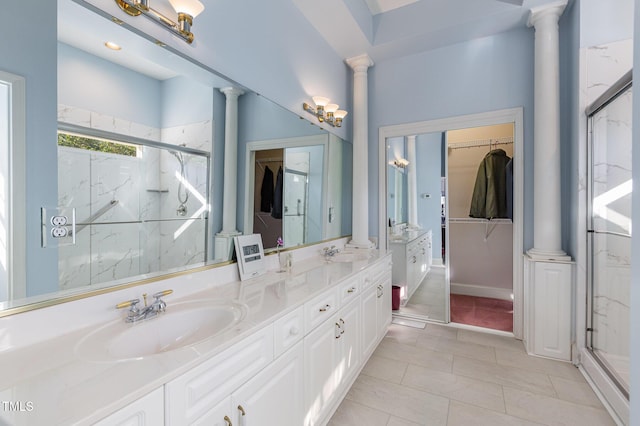 bathroom featuring vanity, tile patterned floors, and a shower with shower door