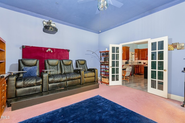 carpeted cinema room with ornamental molding, ceiling fan, french doors, and sink