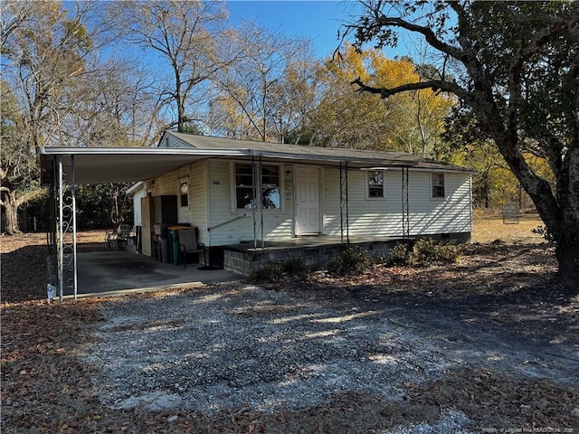 view of front of home with a carport