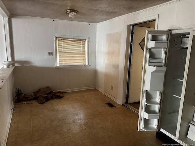 interior space featuring a textured ceiling